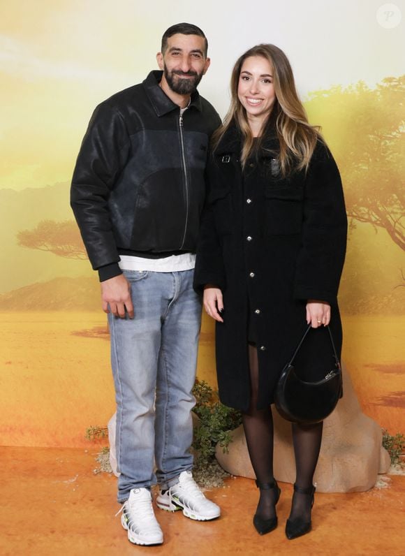 Hedi Bouchenafa et son amie - Première du film Disney "Mufasa, Le Roi lion" au cinéma Pathé Palace à Paris le 12 décembre 2024. © Coadic Guirec/Bestimage