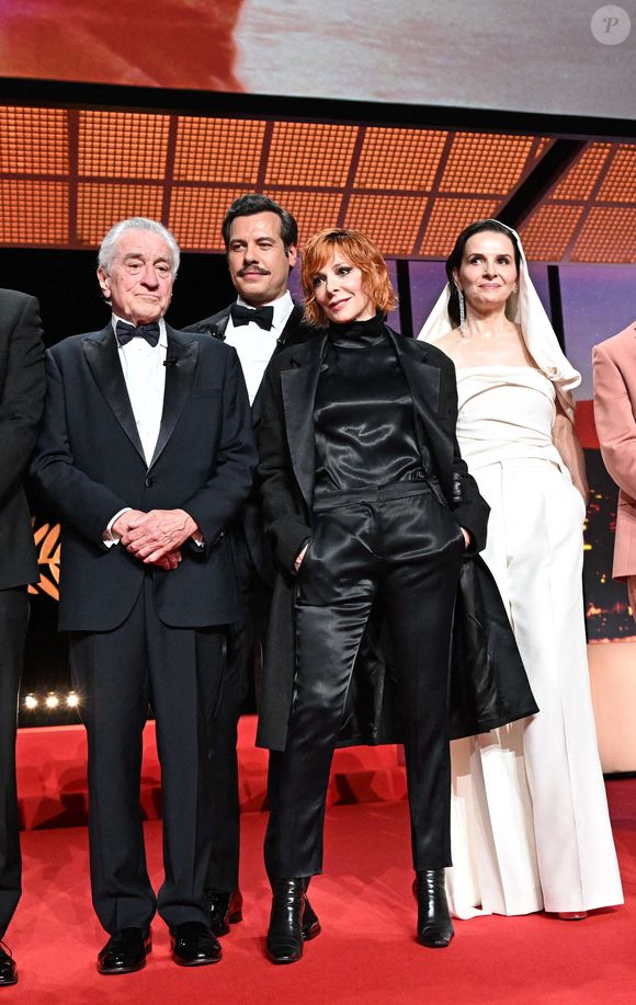 Robert De Niro, Laurent Lafitte, Mylene Farmer et Juliette Binoche, présidente du jury, sur scène lors de la cérémonie d'ouverture du 78e Festival de Cannes au Palais du Festival le 13 mai 2025 à Cannes, France. Photo by David Niviere/ABACAPRESS.COM