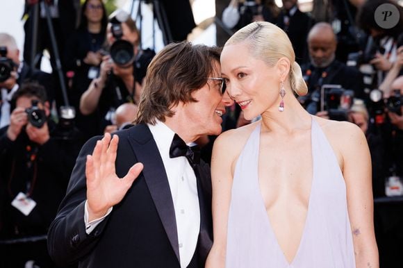 Avec qui il s'est montré assez complice

Tom Cruise, Pom Klementieff - Montée des marches du film « Mission Impossible : The Final Reckoning » lors du 78ème Festival International du Film de Cannes, au Palais des Festivals à Cannes. Le 14 mai 2025
© Jacovides-Moreau / Bestimage