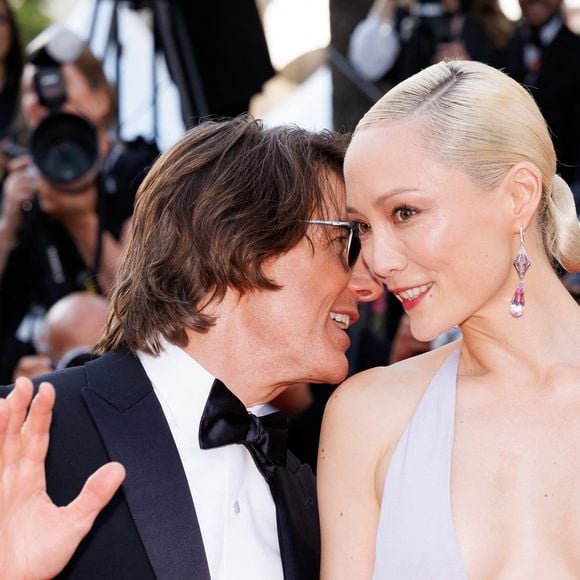 Avec qui il s'est montré assez complice

Tom Cruise, Pom Klementieff - Montée des marches du film « Mission Impossible : The Final Reckoning » lors du 78ème Festival International du Film de Cannes, au Palais des Festivals à Cannes. Le 14 mai 2025
© Jacovides-Moreau / Bestimage