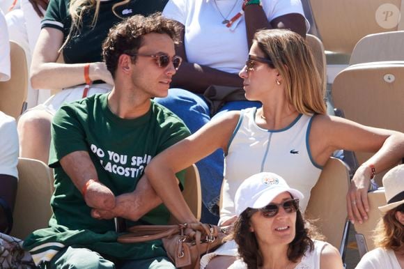 Théo Curin et sa compagne Marie-Camille Fabas - Célébrités dans les tribunes de la finale homme des Internationaux de France de tennis de Roland Garros 2024 à Paris le 9 juin 2024. © Jacovides-Moreau/Bestimage