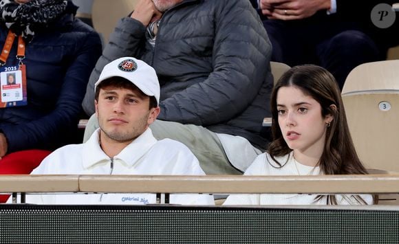 João Neves et sa compagne Madalena Aragão dans les tribunes lors des Internationaux de France de Tennis de Roland Garros 2025. Paris, le 26 mai 2025. © Jacovides-Moreau/Bestimage