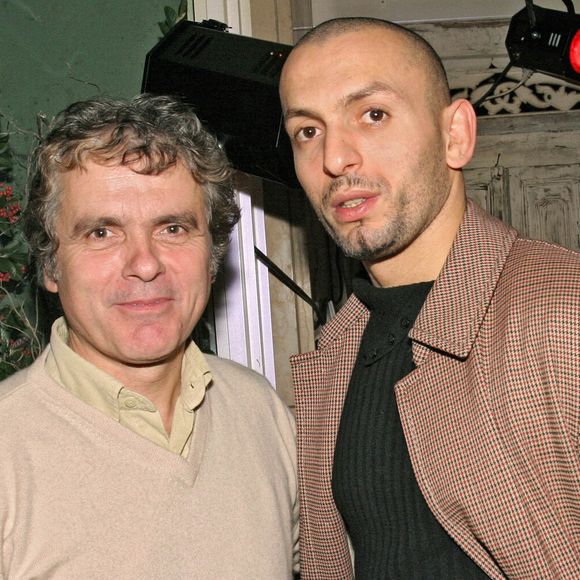 Le journaliste Claude Sérillon et le judoka Jamel Bouras assistent à la soirée de présentation de la nouvelle voiture électrique Bi-Scot au Nirvana à Paris, France, le 18 novembre 2004. Photo par Benoit Pinguet/ABACA.