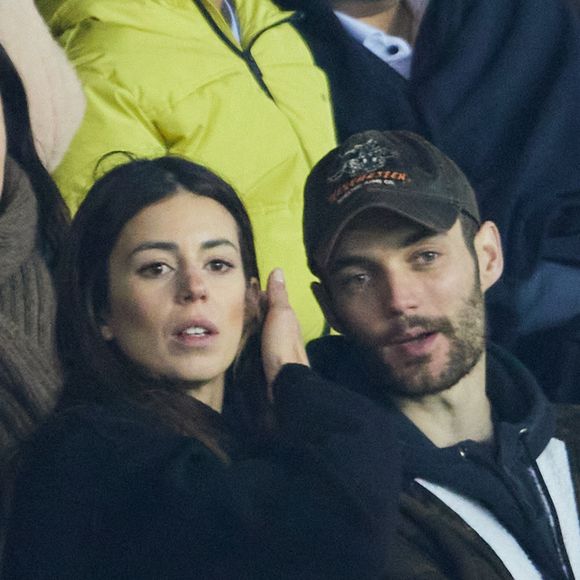 Exclusif - No Web - Louis Sarkozy et sa femme Natali Husic  en tribunes du match de Ligue 1 Uber Eats "PSG contre Reims" (1-1) au Parc des Princes à Paris le 29 janvier 2023 (AGENCE / BESTIMAGE).