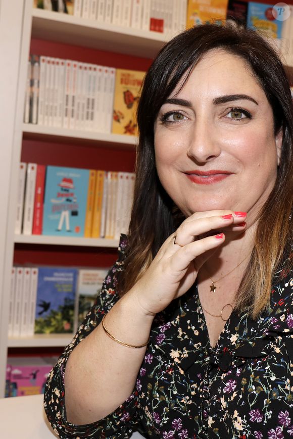L’autrice y confesse avoir failli renoncer à la grossesse...

Virginie Grimaldi - 38ème salon du livre de Paris à la Porte de Versailles, Paris le 17 mars 2018. © Cédric Perrin/Bestimage