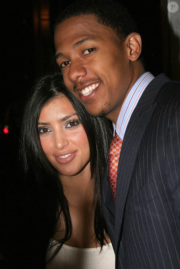 Cet homme, c'est Nick Cannon, rappeur, acteur et présentateur américain né le 8 octobre 1980 à San Diego, qui a été en couple avec Christina Milian de 2003 à 2005.


Kim Kardashian et Nick Cannon à la soirée Rock & Republic Host Spring Collection Party qui s'est tenue à la boîte de nuit Area à Los Angeles. 18 octobre 2006. Photographie : Josesphine Santos, /PCN/ABACAPRESS.COM
