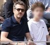 Le jeune homme de 14 ans a également accompagné Guillaume Canet pour la première fois à Roland-Garros cette année

Guillaume Canet, son fils Marcel en tribunes lors de la finale messieurs des Internationaux de France de Tennis de Roland Garros 2025 (jour 15), à Paris, France, le 8 juin 2025. © Cyril Moreau/Bestimage