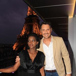 Exclusif - Hapsatou Sy et son mari Vincent Cerruti - Le Grand Dîner du 14 juillet, sur le rooftop de l'hôtel Pullman Tour Eiffel à Paris, France, le 14 juillet 2021. 
© Philippe Baldini/Bestimage