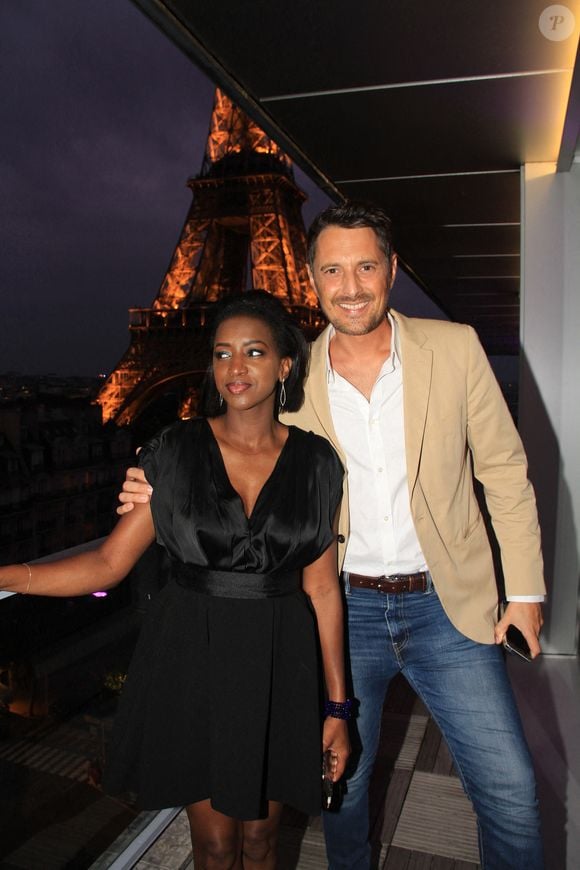 Exclusif - Hapsatou Sy et son mari Vincent Cerruti - Le Grand Dîner du 14 juillet, sur le rooftop de l'hôtel Pullman Tour Eiffel à Paris, France, le 14 juillet 2021. 
© Philippe Baldini/Bestimage