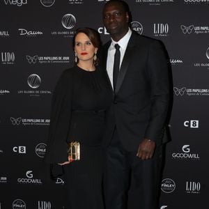 Omar Sy et sa femme Hélène au photocall de la 11ème cérémonie des Globes de Cristal au Lido à Paris le 30 janvier 2017. © CVS / Bestimage