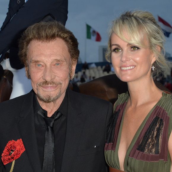 Johnny Hallyday et sa femme Laeticia Hallyday - Remise du Prix Eiffel avec Johnny et Laeticia Hallyday - Record du saut en hauteur de la ville de Paris / EOS - Longines Paris Eiffel Jumping à la plaine de Jeux de Bagatelle à Paris le 1er juillet 2016. Cette remise de prix est le prologue de la soirée au profit de l'association "La bonne étoile" de Laeticia Hallyday.
© Olivier Borde / Veeren / Bestimage