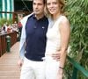 "J’ai dû rentrer en urgence en France pour assurer la continuité du concours, en laissant derrière moi mon fils âgé de quelques semaines et Camille"
L'ancienne Miss France Sylvie Tellier et son petit ami Camille assistent à la finale masculine de Roland Garros entre l'Espagnol Rafael Nadal et l'Argentin Mariano Puerta à Paris, France, le 5 juin 2005. Photo Gorassini-Zabulon/ABACA.