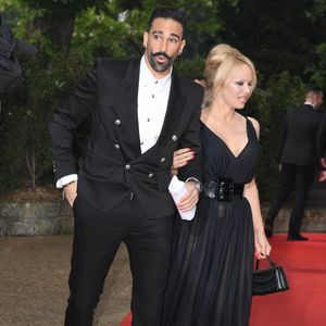 Adil Rami et sa compagne Pamela Anderson arrivent à la 28ème cérémonie des trophées UNFP (Union nationale des footballeurs professionnels) au Pavillon d'Armenonville à Paris, France, le 19 mai 2019. © Coadic Guirec/Bestimage