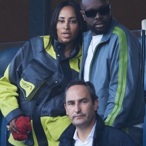 Gims et sa femme Demdem - Célébrités dans les tribunes de la demi-finale retour de Ligue des champions entre le PSG face au Borussia Dortmund (0-1) au Parc des Princes à Paris le 7 mai 2024. © Cyril Moreau/Bestimage