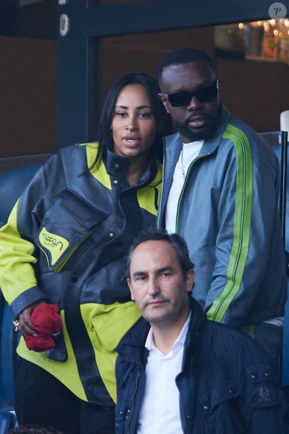 Gims et sa femme Demdem - Célébrités dans les tribunes de la demi-finale retour de Ligue des champions entre le PSG face au Borussia Dortmund (0-1) au Parc des Princes à Paris le 7 mai 2024. © Cyril Moreau/Bestimage