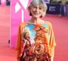Son top orange à motifs ? "Trouvé à Porto, c'était deux euros dans une friperie" explique la chanteuse.


Lio lors de l'ouverture de la 52ème édition du Festival du Cinema Américain de Deauville, France, le 4 septembre 2026. 

© Denis Guignebourg/Bestimage