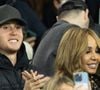 Celui d'Elvis Guetta. 

Cathy Guetta et son fils Tim Elvis Guetta - Célébrités dans les tribunes lors du match de Ligue des Champions entre le Paris Saint Germain contre Tottenham Hotspur Football Club (5-3) au Parc des Princes à Paris le 26 novembre 2025. © Cyril Moreau/Bestimage