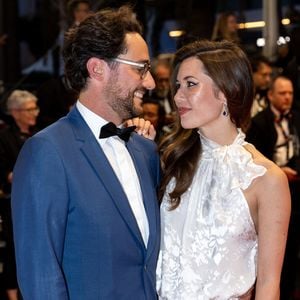 Thomas Hollande, sa femme Emilie Broussouloux - Montée des marches du film "R.M.N." lors du 75ème Festival International du Film de Cannes, le 21 mai 2022.
© Cyril Moreau / Bestimage