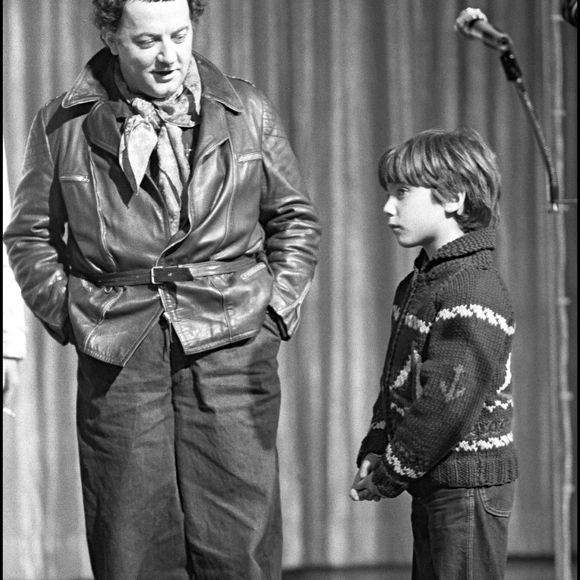 Archives - Coluche et son fils Romain Colucci sur scène en 1980.
Crédit : ASLAN / BESTIMAGE
