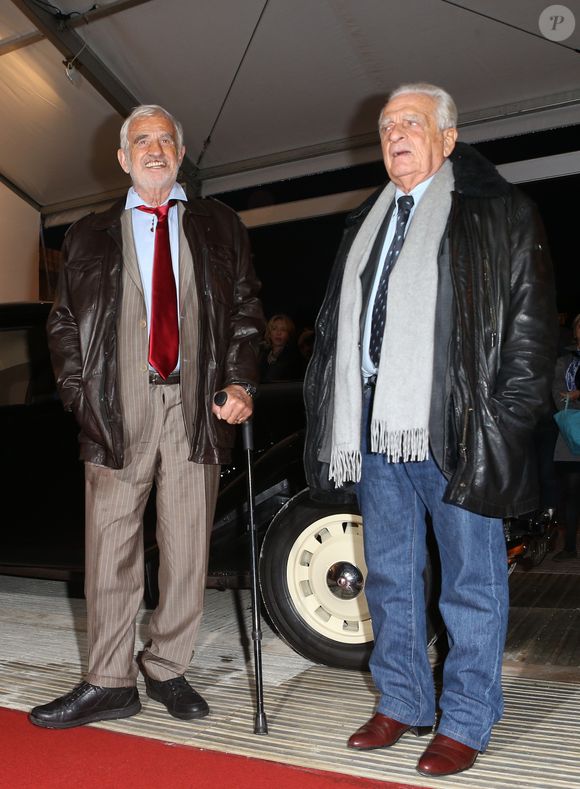 Jean-Paul Belmondo et son frere Alain Belmondo - Inauguration de l’exposition "100 ans de police judiciaire de Paris", parrainee par l’acteur Jean-Paul Belmondo, au Champ de Mars a Paris le 8 Novembre 2013. CYRIL MOREAU / BESTIMAGE