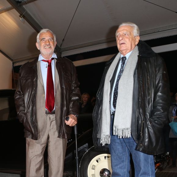 Jean-Paul Belmondo et son frere Alain Belmondo - Inauguration de l’exposition "100 ans de police judiciaire de Paris", parrainee par l’acteur Jean-Paul Belmondo, au Champ de Mars a Paris le 8 Novembre 2013. CYRIL MOREAU / BESTIMAGE