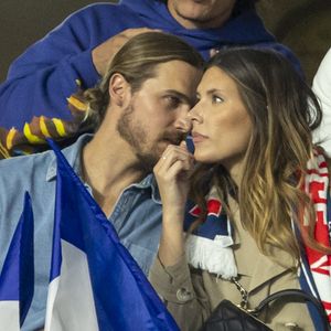 Camille Cerf (Miss France 2015) et son compagnon Théo Fleury dans les tribunes lors du match de la 5ème et avant-dernière journée de Ligue des nations entre la France et l'Autriche (2-0) au Stade de France à Saint-Denis le 22 septembre 2022.