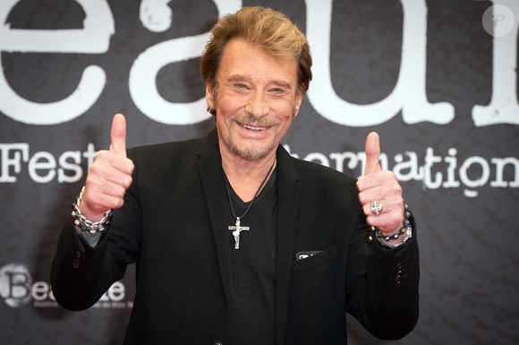 Johnny Hallyday assiste au 6ème Festival International du Film Policier à Beaune, France, le 2 avril 2014. La plus grande star française du rock, Johnny Hallyday, est décédé des suites d'un cancer du poumon, a annoncé son épouse. Il avait 74 ans. Le chanteur - de son vrai nom Jean-Philippe Smet - a vendu environ 100 millions de disques et joué dans de nombreux films. ©Nicolas Gouhier/ABACAPRESS.COM
