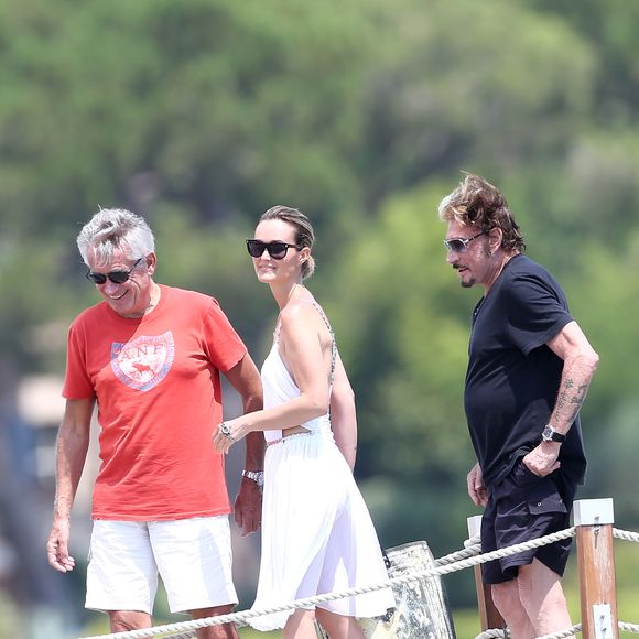 Gilbert Coullier et Laeticia Hallyday - Johnny Hallyday est arrivé en famille sur la plage Tahiti à Saint-Tropez, le 20 juillet 2012. ©Bestimage