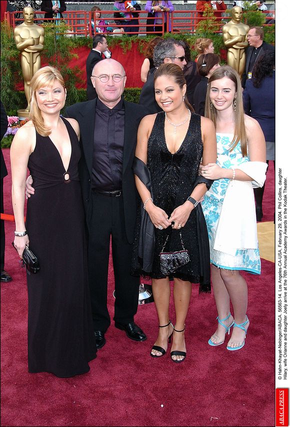 Phil Collins, sa femme Orianne et sa fille Joely lors de la 76ème cérémonie des Oscars le dimanche 29 février 2004 au Kodak Theatre à Los Angeles-CA. (Photo : Phil Collins) Photo Hahn-Khayat-Nebinger/ABACA