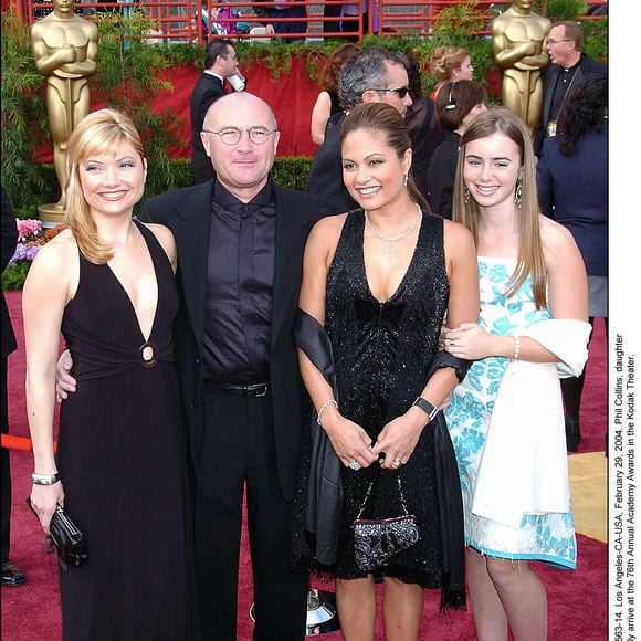 Phil Collins, sa femme Orianne et sa fille Joely lors de la 76ème cérémonie des Oscars le dimanche 29 février 2004 au Kodak Theatre à Los Angeles-CA. (Photo : Phil Collins) Photo Hahn-Khayat-Nebinger/ABACA