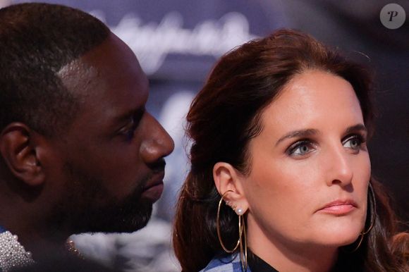 Omar Sy et son épouse Hélène Sy, au premier rang du défilé Louis Vuitton Homme Automne-Hiver 2024-2025, lors de la Fashion Week de Paris, le 16 janvier 2024. Photo : Jana Call me J/ABACAPRESS.COM