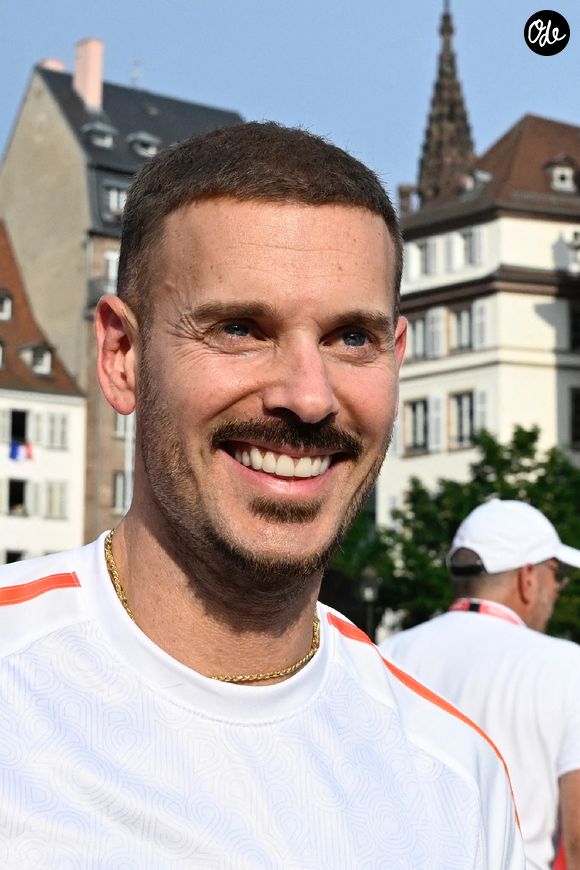 Le chanteur Matt Pokora assiste au relais de la flamme olympique à Strasbourg, dans le nord-est de la France, le 26 juin 2024. 36 porteurs ont porté la flamme sur 200 m le long d'un parcours de 7,2 km, du Parlement européen à la place Kléber. Photo de Nicolas Roses/ABACAPRESS.COM