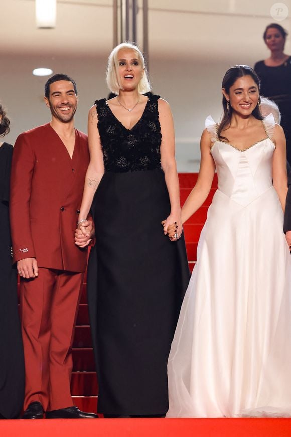 La réalisation de Julia Ducournau, avec Tahar Rahim, sort dans les salles le 20 août prochain

Tahar Rahim, Julia Ducournau, Golshifteh Farahani - Montée des marches du film « Alpha » lors du 78ème Festival International du Film de Cannes, au Palais des Festivals à Cannes. Le 19 mai 2025
© Jacovides-Moreau / Bestimage