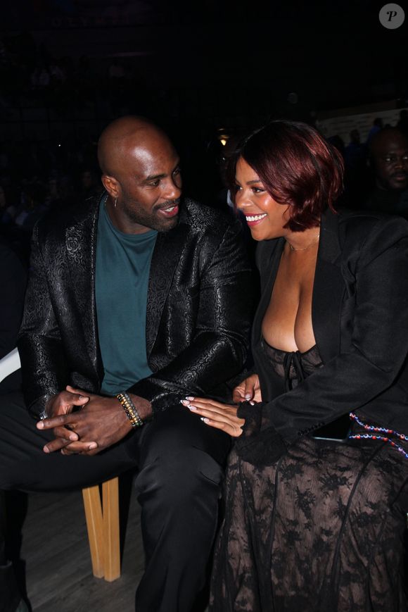 Teddy Riner et sa femme Luthna - Soirée de remerciement de Teddy Riner à la Maison du judo à Montrouge, le 29 novembre 2024. Devant une centaine d'invités, Le champion olympique (11 fois) et champion olympique (5 fois) a tenu à remercier tous ceux qui l'ont soutenu tout au long de son impressionnante carrière, de son premier entraîneur en club jusqu’à sa femme et sa mère, en passant par sa psychologue de l’INSEP. Une vente aux enchères au profit de l'association de Teddy Riner a conclu la soirée. 
© Philippe Baldini / Bestimage