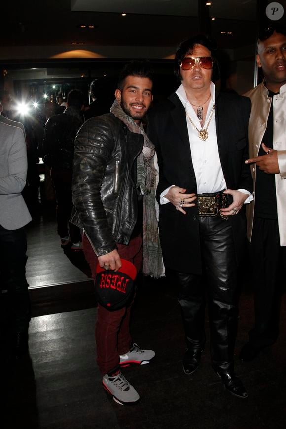 Tony Bredelet et Eryl Prayer assistent au Defile de Mode Omar Jeans, au pavillon Champs Elysees, a Paris le 31 mars 2013.