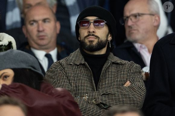 Sofiane Pamart dans les tribunes du match de football de qualification pour la coupe du monde 2026 opposant la France à Azerbaïdjan (3-0) au Parc des Princes à Paris, France, le 10 octobre 2025. © Cyril Moreau/Bestimage
