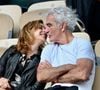 Raymond Domenech et sa nouvelle compagne à Roland Garros à Paris, France. Photo ABACAPRESS.COM
