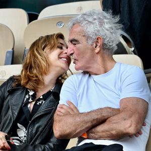 Raymond Domenech et sa nouvelle compagne à Roland Garros à Paris, France. Photo ABACAPRESS.COM