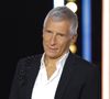 Selon lui, il s'agissait de favoritisme de la part de la société de production Banijay en faveur de Nagui, qui en est actionnaire.

Nagui lors de la 37ème édition du Téléthon sur le plateau de France 2.

Photo : Coadic Guirec / Bestimage
