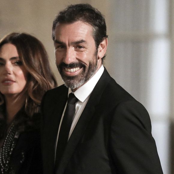 L'ancien joueur de football français Robert Pires et sa femme Jessica - Dîner au Palais de l'Elysée en l'honneur des 50 ans du Variétés Club de France, à Paris, le 14 octobre 2021. © Stéphane Lemouton / Bestimage