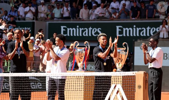 Bradley Barcola, Warren Zaïre-Emery, Désiré Doué et Ousmane Dembélé - Le Paris Saint-Germain (PSG) présente ses trophées de Ligue des champions aux Internationaux de de Tennis de Roland Garros 2026, à Paris, France, le 1er juin 2026. © Jacovides-Moreau/Bestimage