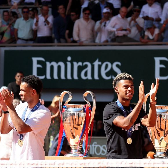 Bradley Barcola, Warren Zaïre-Emery, Désiré Doué et Ousmane Dembélé - Le Paris Saint-Germain (PSG) présente ses trophées de Ligue des champions aux Internationaux de de Tennis de Roland Garros 2026, à Paris, France, le 1er juin 2026. © Jacovides-Moreau/Bestimage