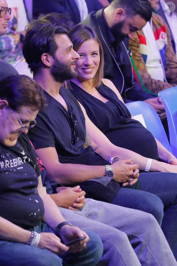 Maxim Nucci (Yodelice) et sa compagne enceinte Isabelle Ithurburu - Maxim Nucci (Yodelice) et sa compagne enceinte Isabelle Ithurburu assistent au match de boxe de Tony Yoka au palais des sports de Paris, le 23 juin 2018 © Veeren-CVS/Bestimage