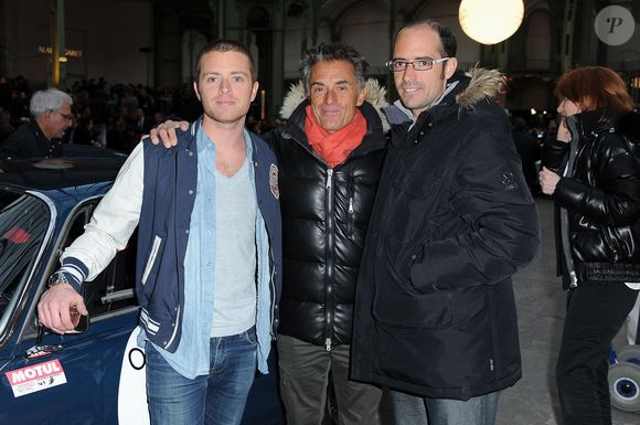 Comme lui, Antoine et Julien sont amateurs de sport.

Gérard Holtz et ses fils Julien et Antoine apparaissent lors des vérifications et contrôles des voitures de course des participants du Tour Auto Optic 2000 2012 exposées au Grand Palais à Paris, France, le 16 avril 2012. Photo par Nicolas Briquet/ABACAPRESS.COM