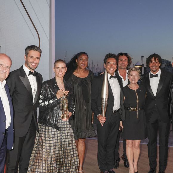 Exclusif - Pierre Lescure, Tony Estanguet, Marie Patouillet et la flamme olympique, Marie-José Perec, Patrick Cohen, Bertrand Chameroy,  Anne-Elisabeth Lemoine, Arnaud Assoumani, Mohamed Bouhafsi - Plateau de l'émission "C à vous" lors du 77ème Festival International du Film de Cannes le 21 mai 2024. © Jack Tribeca/Bestimage  No Web - Belgique et Suisse