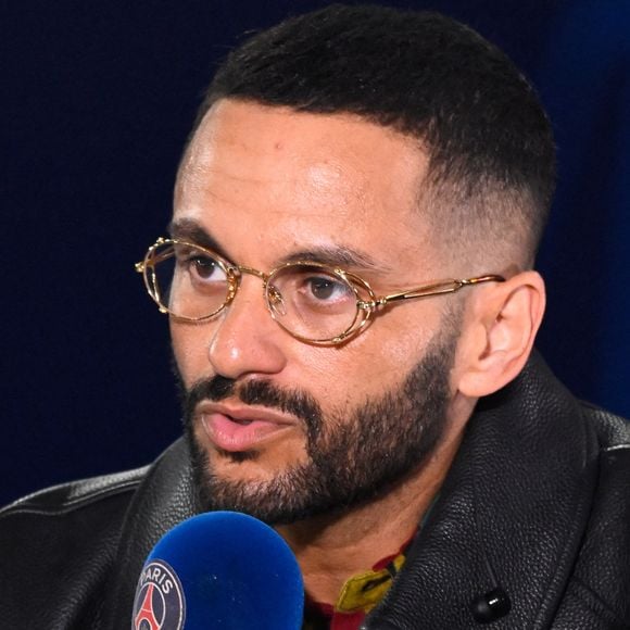 Malik Bentalha - Célébrités dans les tribunes du match aller des huitièmes de finale de la Ligue des champions entre le PSG et la Real Sociedad (2-0) au Parc des Princes à Paris le 14 février 2024.