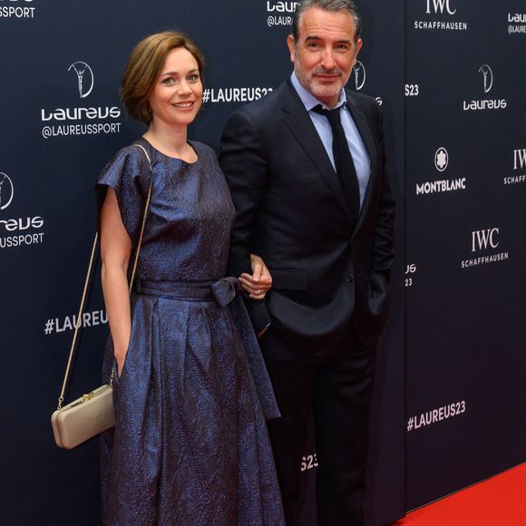 L'acteur Jean Dujardin et la danseuse sur glace Nathalie Pechalat arrivent au tapis rouge des Laureus World Sport Awards Paris 2023 à la Cour Vendôme le 08 mai 2023 à Paris, France. Photo by ABACAPRESS.COM