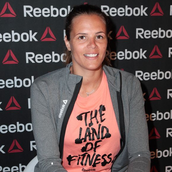 L'ambassadrice de l'équipe Reebok, Laure Manaudou, assiste à une séance de dédicaces pour le lancement de la campagne " Live with Fire " qui s'est tenue au magasin Intersport Rivoli à Paris, France, le 23 avril 2014. Photo by Audrey Poree/ABACAPRESS.COM