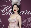 Plusieurs célébrités étaient présentes, dont Bella Hadid, Demi Moore, Adriana Lima et Carla Bruni.

Dita von Teese - Photocall de la soirée " Chopard Miracle Gala Evening " lors du 79ème Festival International du Film de Cannes. Le 18 mai 2026
© Olivier Borde / Bestimage