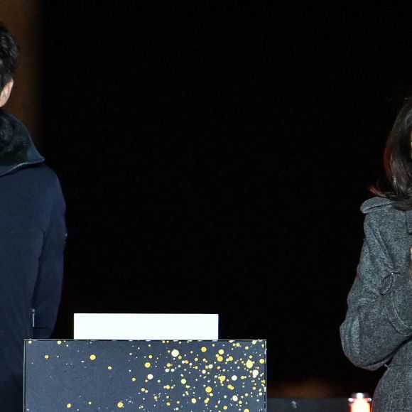La maire de Paris Anne Hidalgo prononce un discours aux côtés du président de Paris 2024, Tony Estanguet, lors de l'inauguration des illuminations de Noël des Champs Elysées à Paris, le 24 novembre 2024. Photo by Firas Abdullah/ABACAPRESS.COM